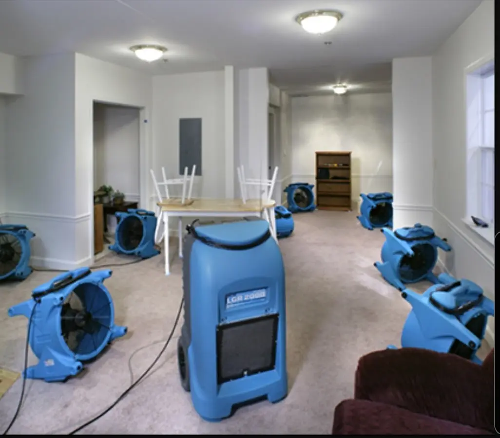 Air movers and dehumidifier setup for Water Damage Restoration in Monfort Heights